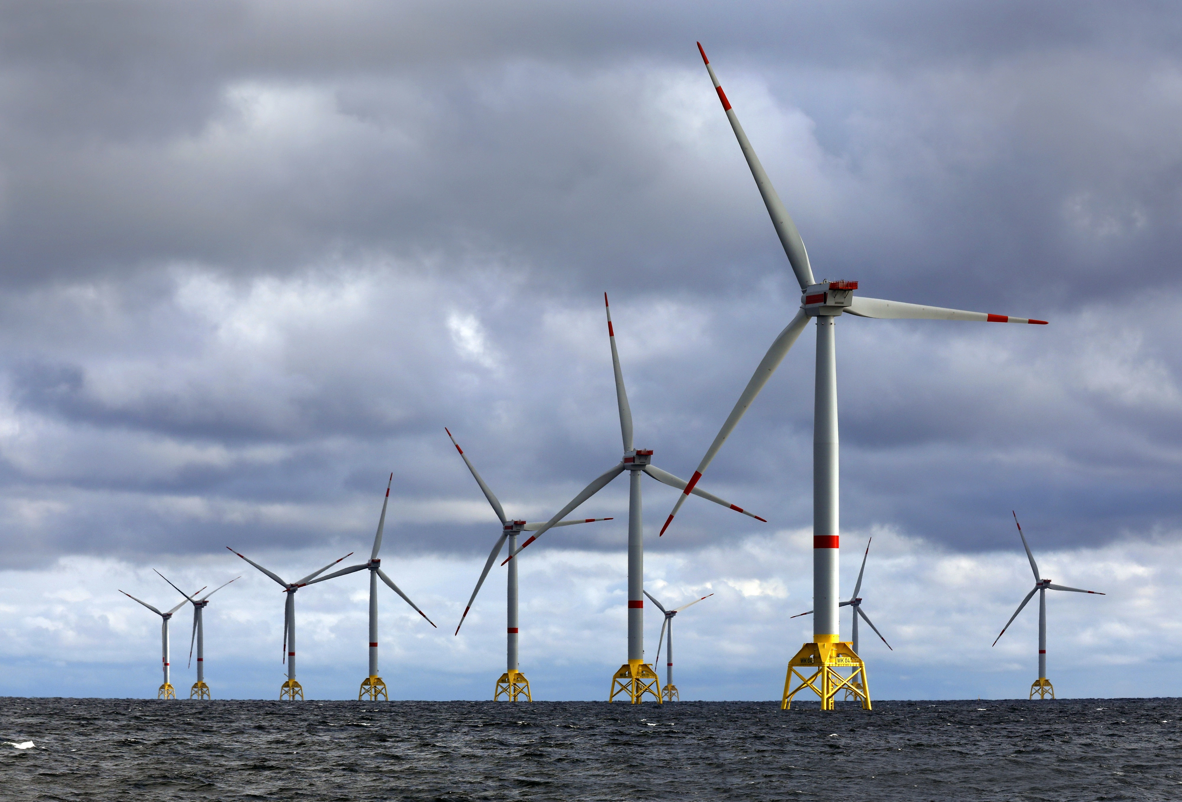 Image of an offshore wind farm with turbines generating energy at sea
